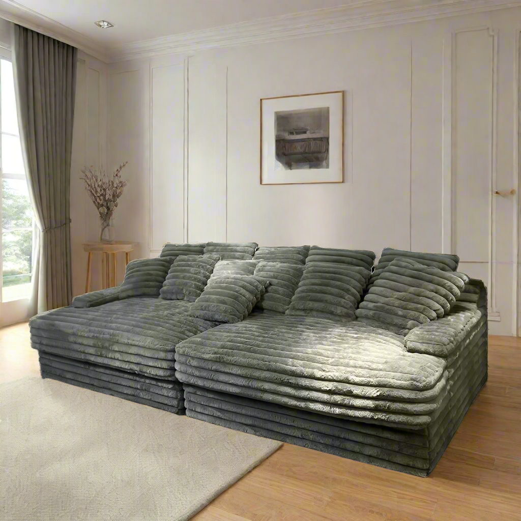 image Gray sectional sofa with multiple cushions on a transparent background