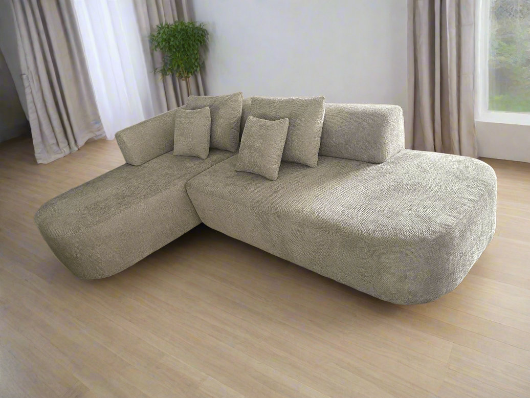 Beige sectional sofa with cushions on a transparent background